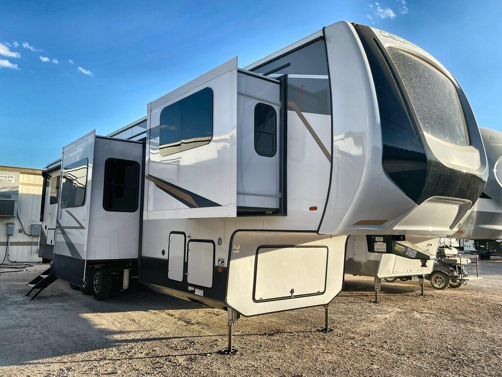 exterior shot of cedar creek 385th, a toy hauler fifth wheel, with its two sliders out
